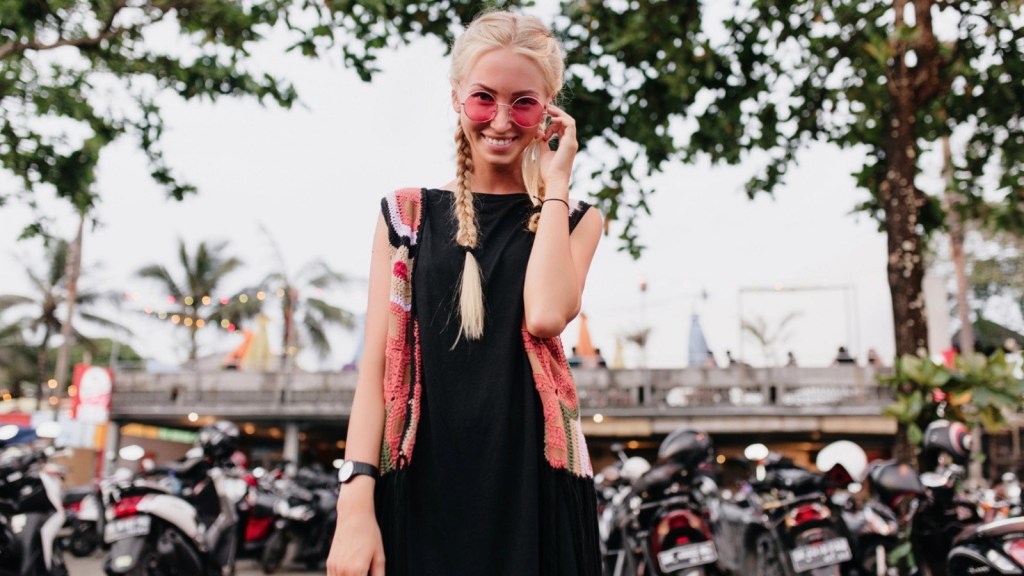 Blonde woman standing in front of motorcycles