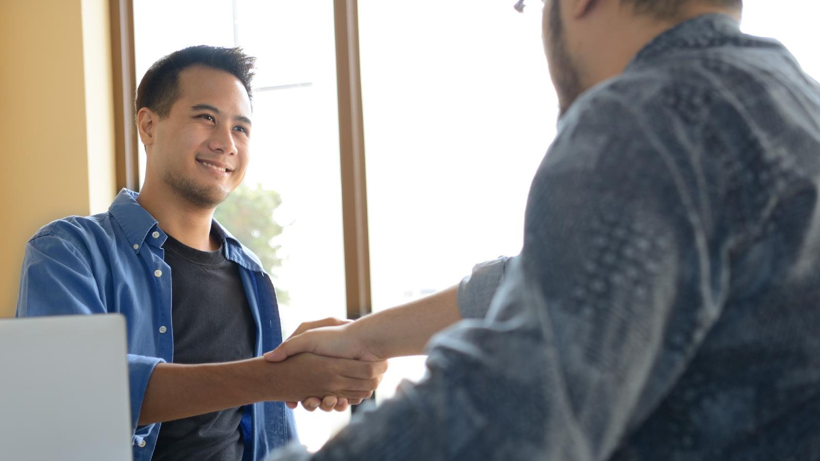 two men shaking hands