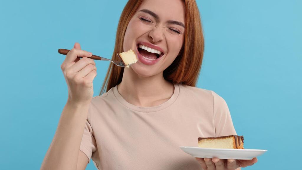 woman eating a piece of cake