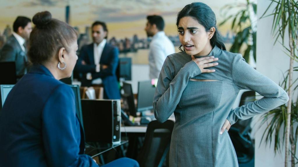 annoyed female employee talking to her boss