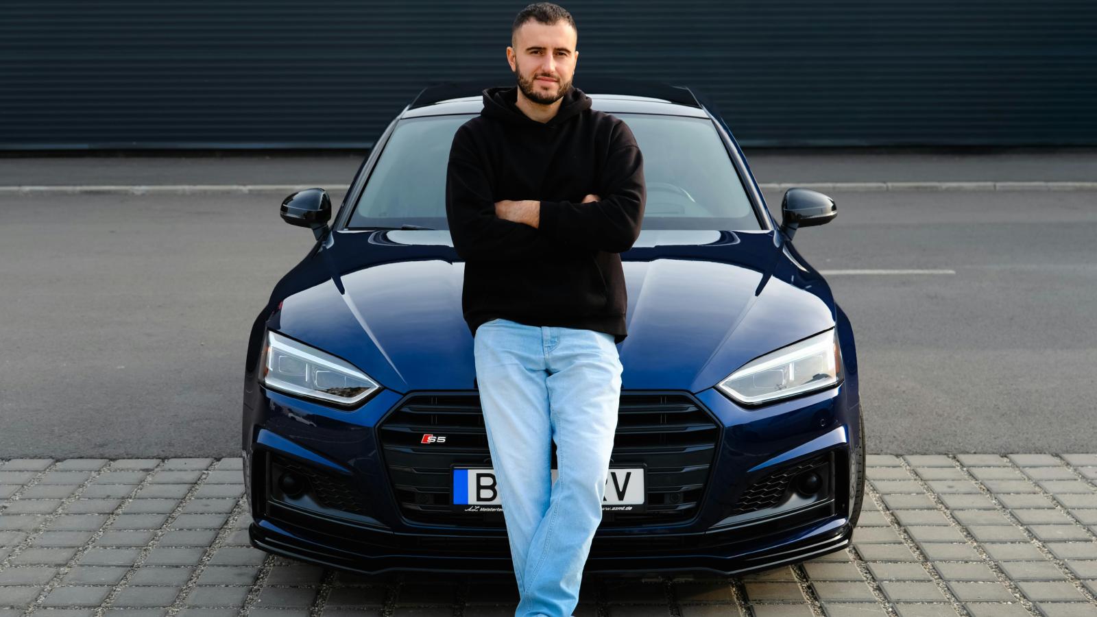 man in front of a car