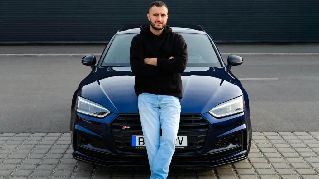 man in front of a car