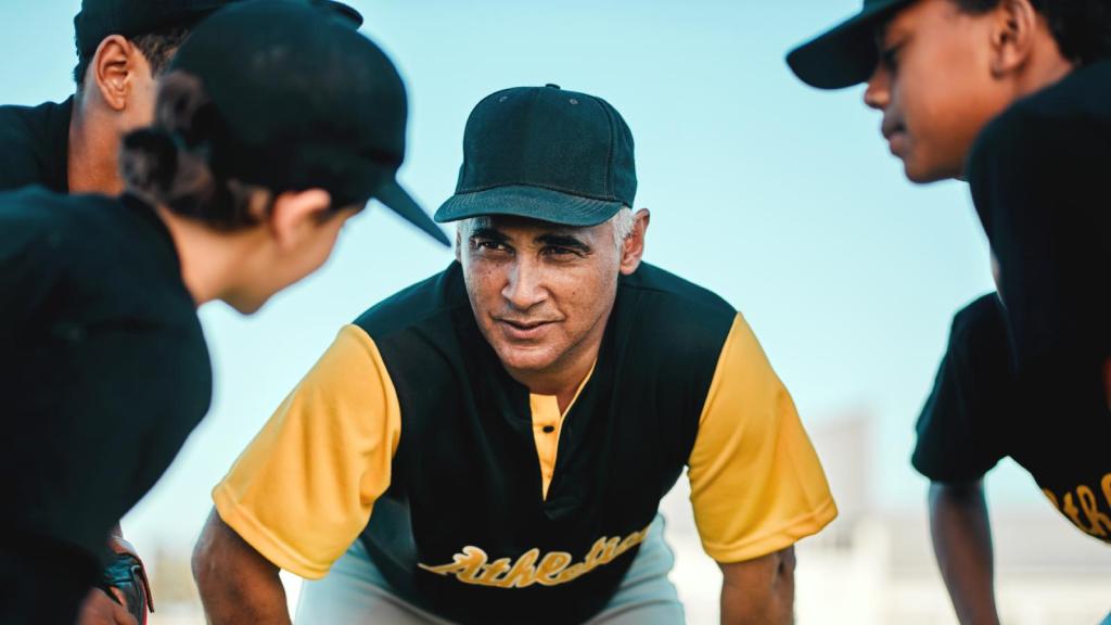 baseball coach with kids