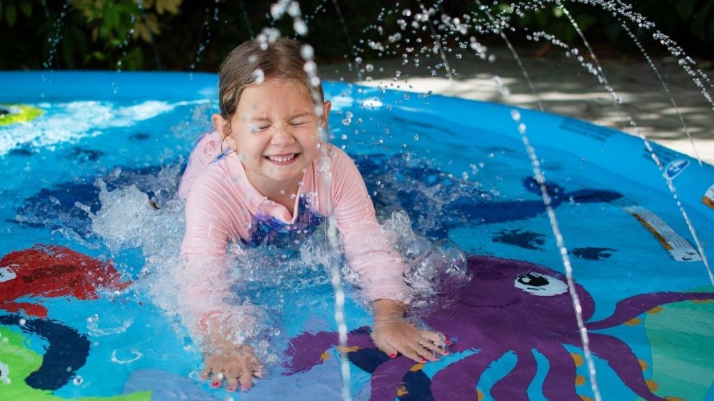 little girl on splash pad