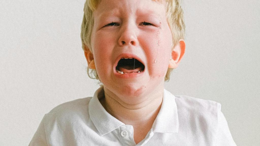blonde little kid crying