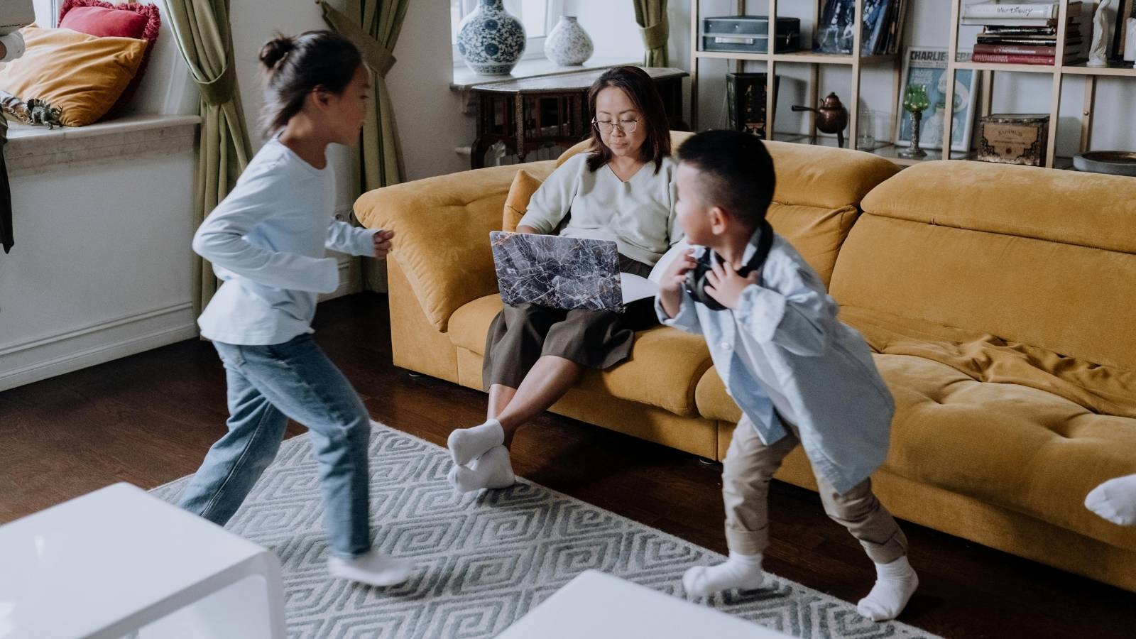 busy mom with kids running around