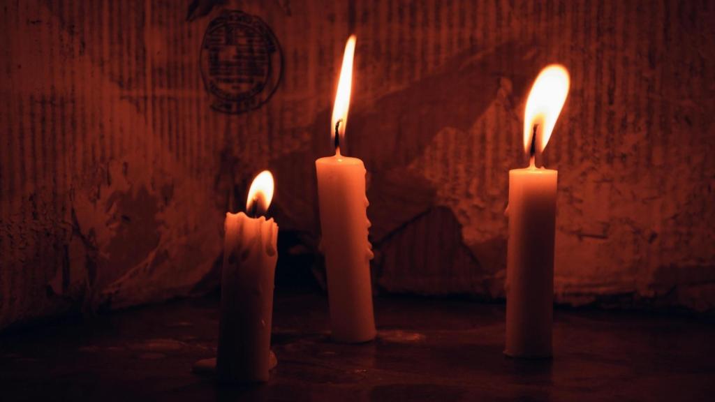 candles lit in a dark room