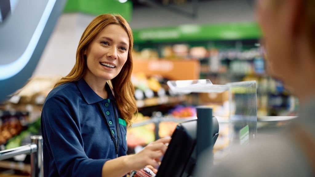 cashier smiling at customer