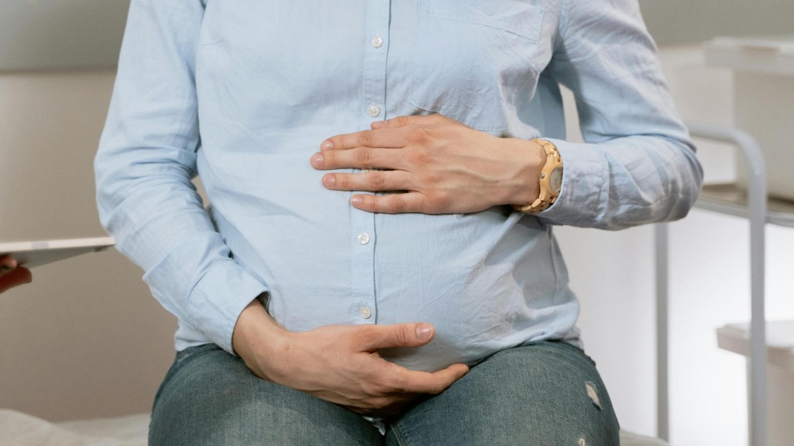 MIL Who Sneaked Into Hospital Delivery Room Against Explicit Orders Permanently Ruins Her Relationship With New Mother closeup of pregnant woman holding her stomach