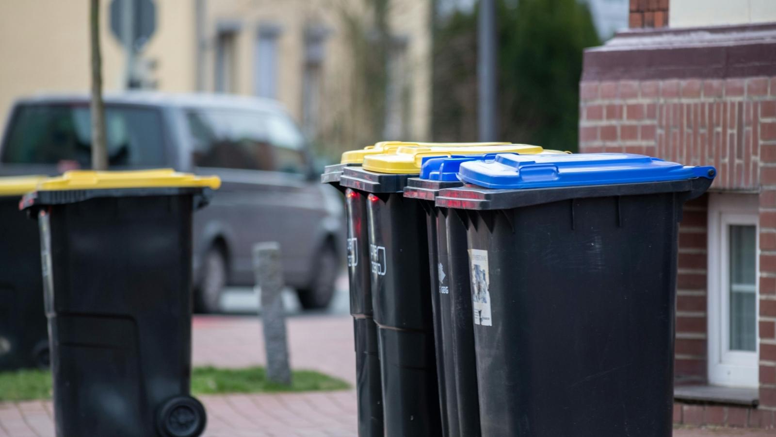 closeups of black trash bins