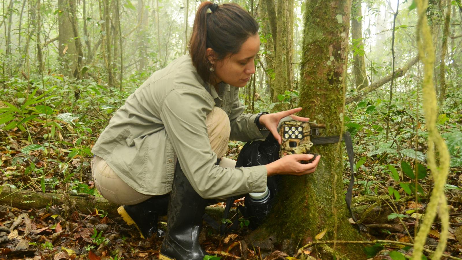 woman with a trail camera