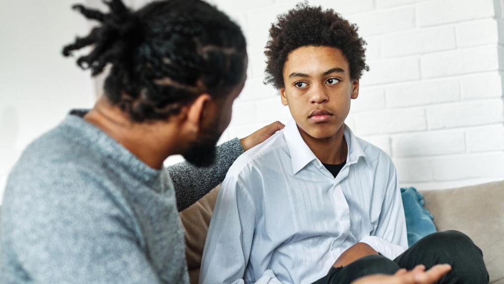 teenager talking to his dad