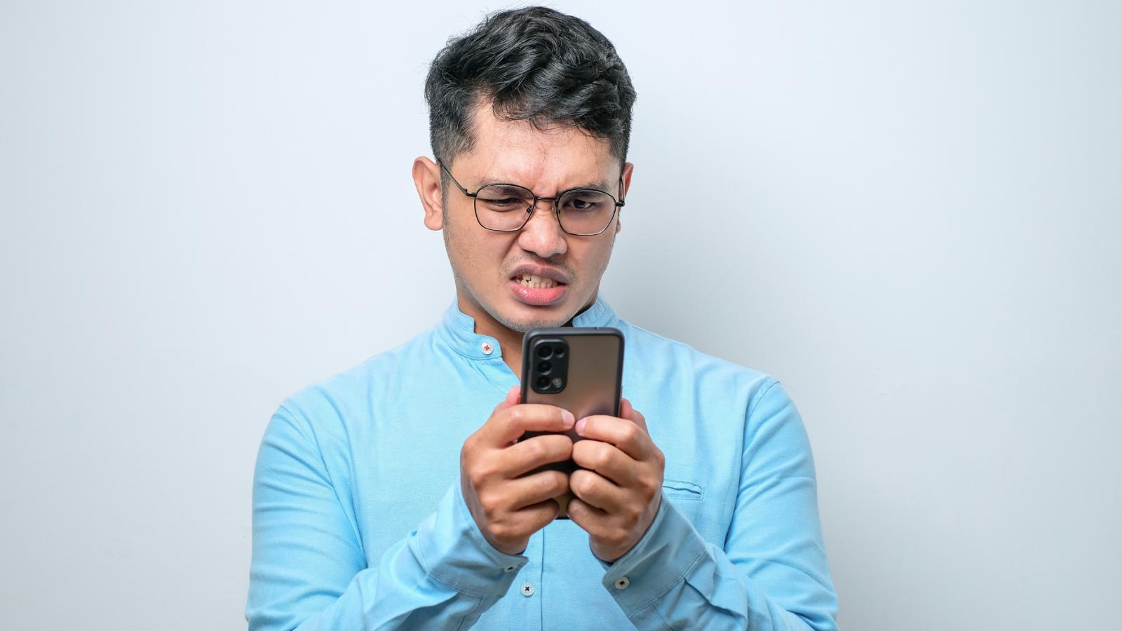 man looking at his phone