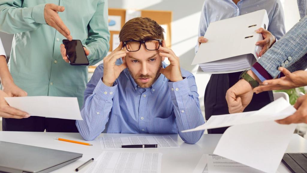 man stressed out at desk