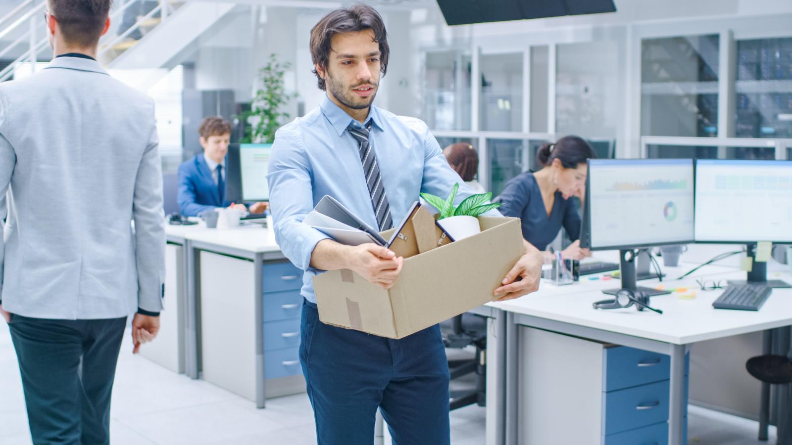 They Thought Their New Job Was Going Fine Until They Were Suddenly Fired After Only a Week man holding a box