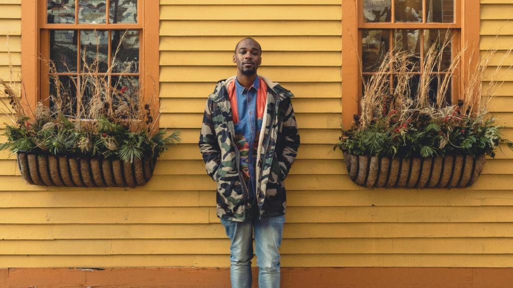 man in front of a house