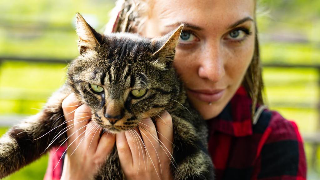 woman holding a cat