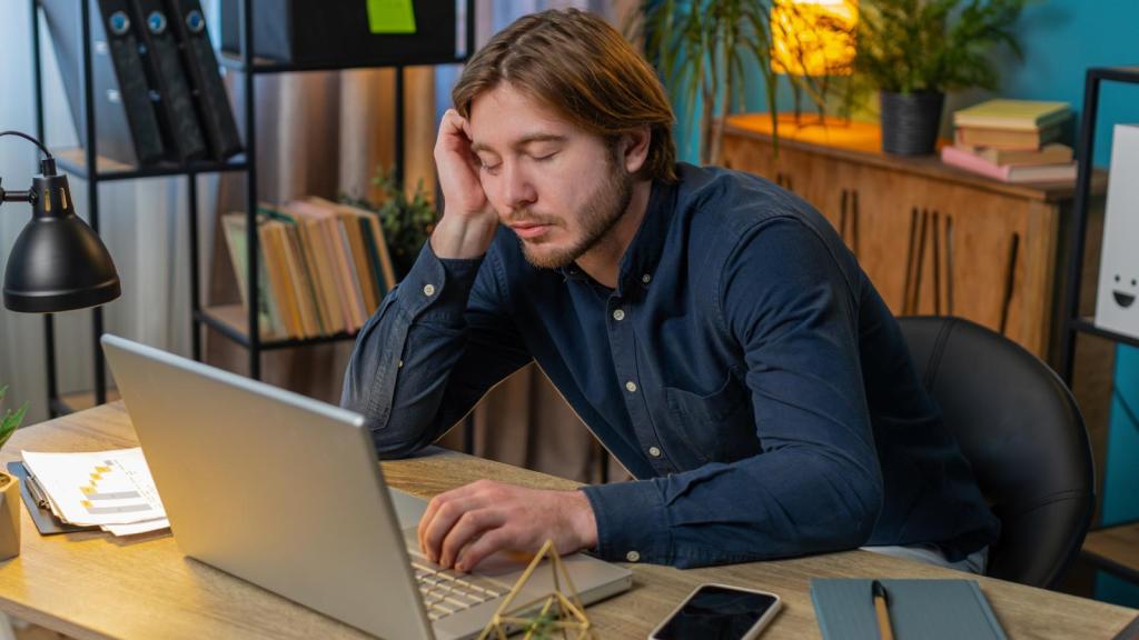 man asleep at his desk