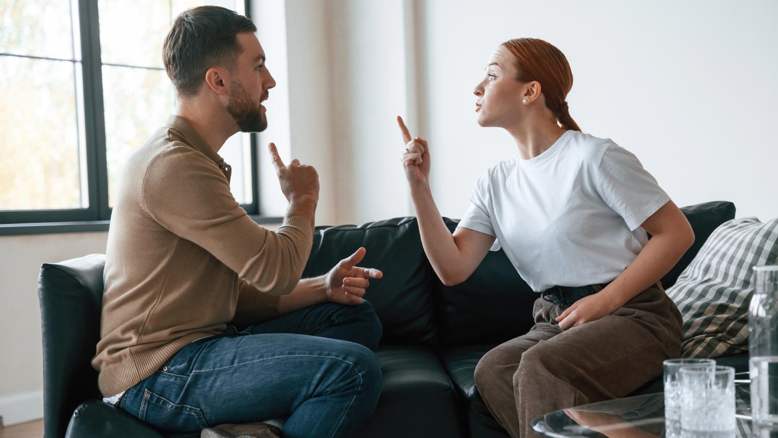 couple arguing on a couch