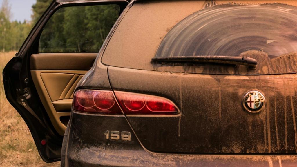dirty car covered in dust