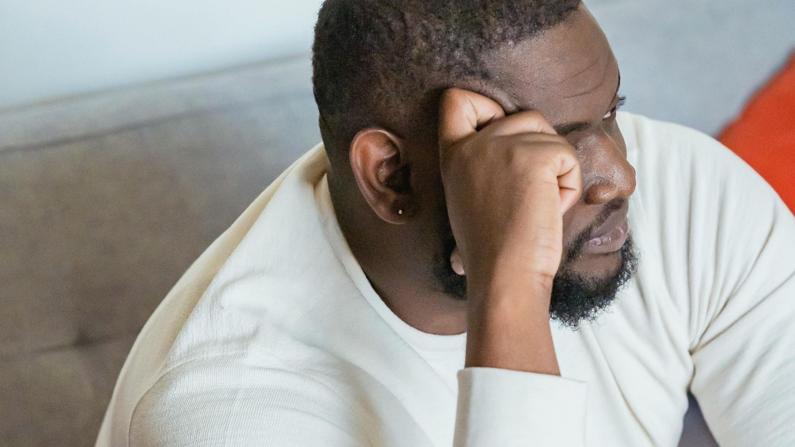 Adopted Son Questions Mother’s Day Gift After Years of Feeling Less Favored Than Brother man in thought