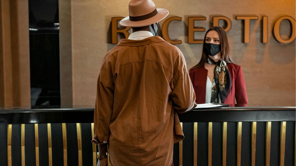 Guest talking to hotel receptionist