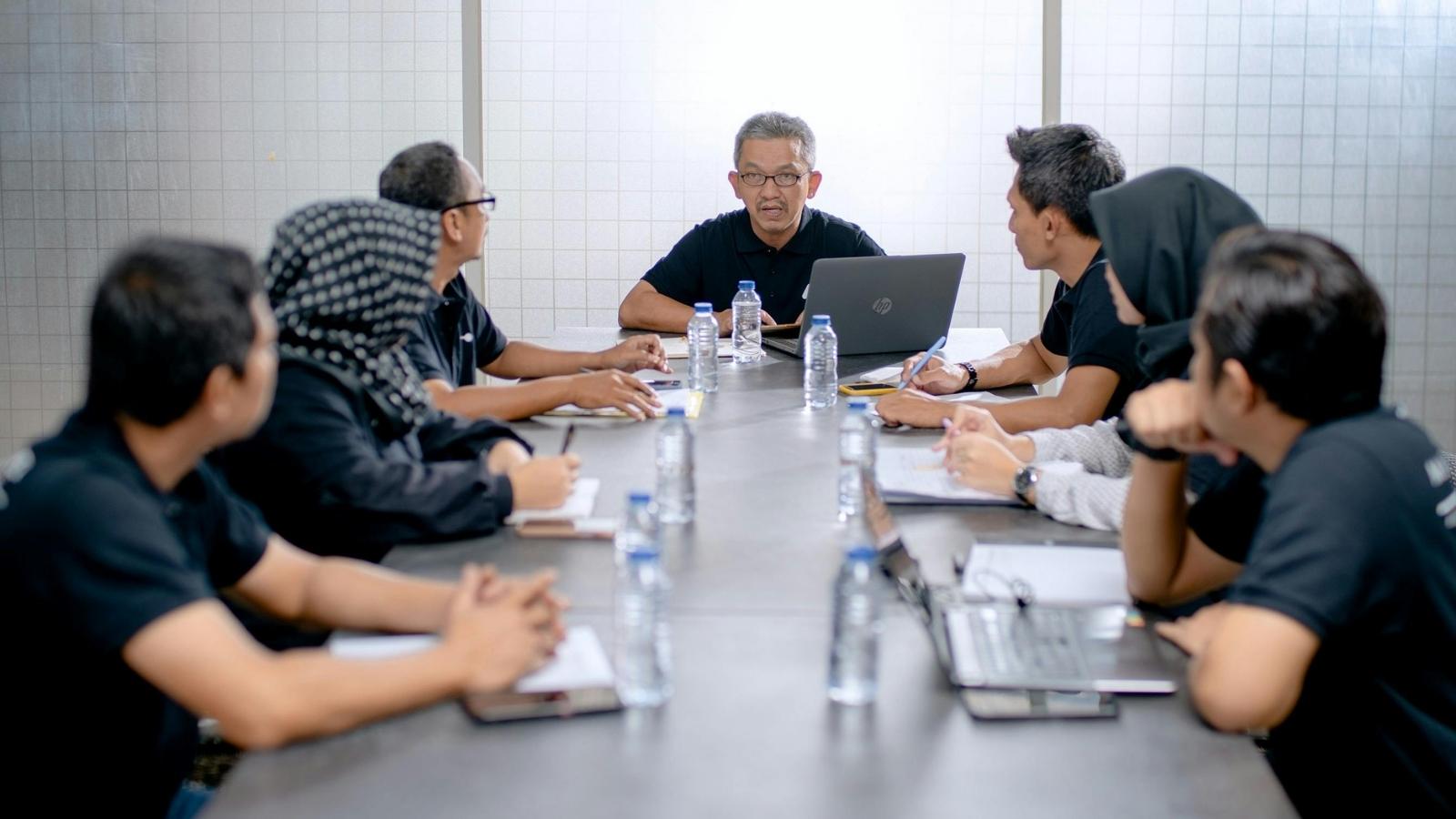 employees sitting at a conference table