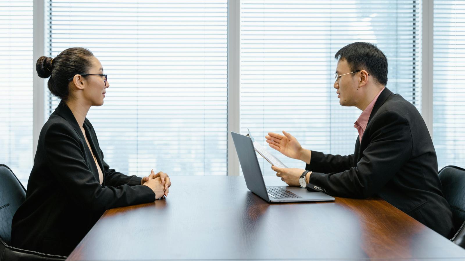 Employee Declines Promotion, Saying He Doesn’t Want More Responsibility two people having a meeting
