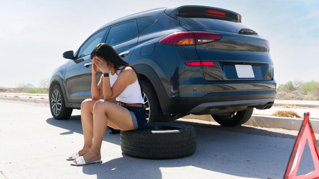 woman with a flat tire