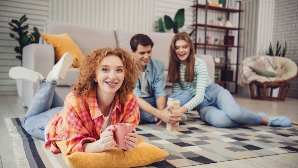 group of friends playing jenga