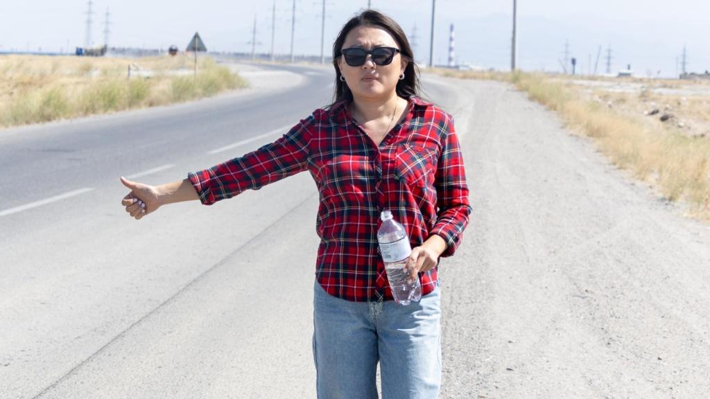 young woman on side of the road