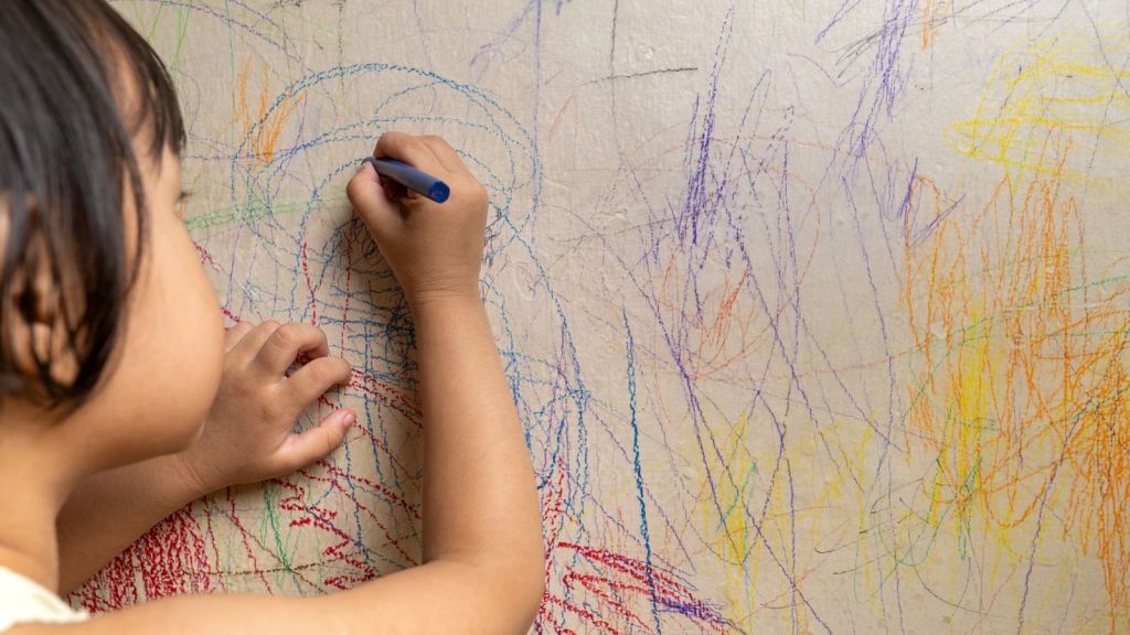 toddler drawing on the walls