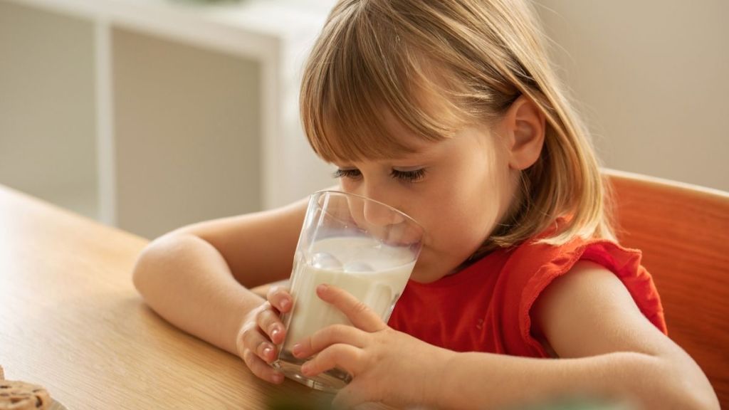 little girl drinking milk