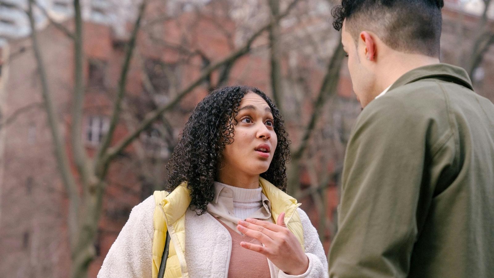 man and woman arguing outside