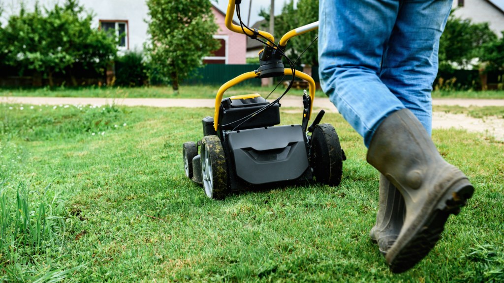 A person mowing a lawn