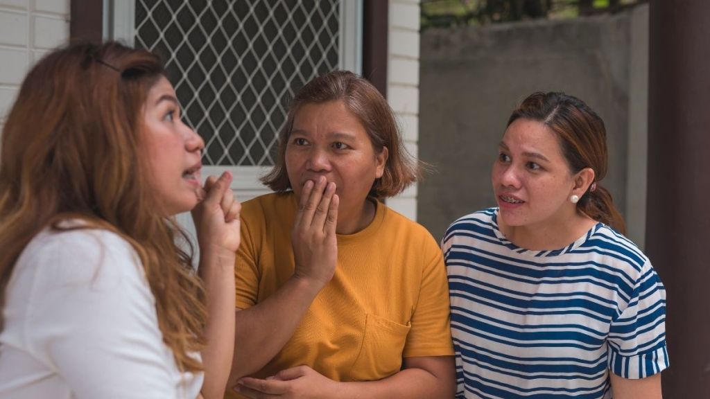 three female neighbors gossiping