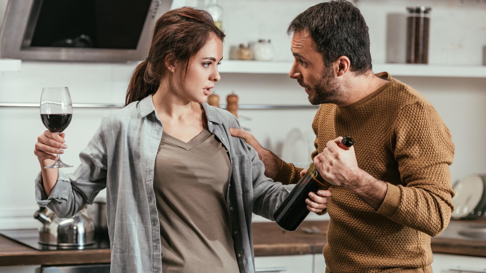 Person Upset as Out of Work Spouse Criticizes Their Preferred Dinner Time couple in a kitchen