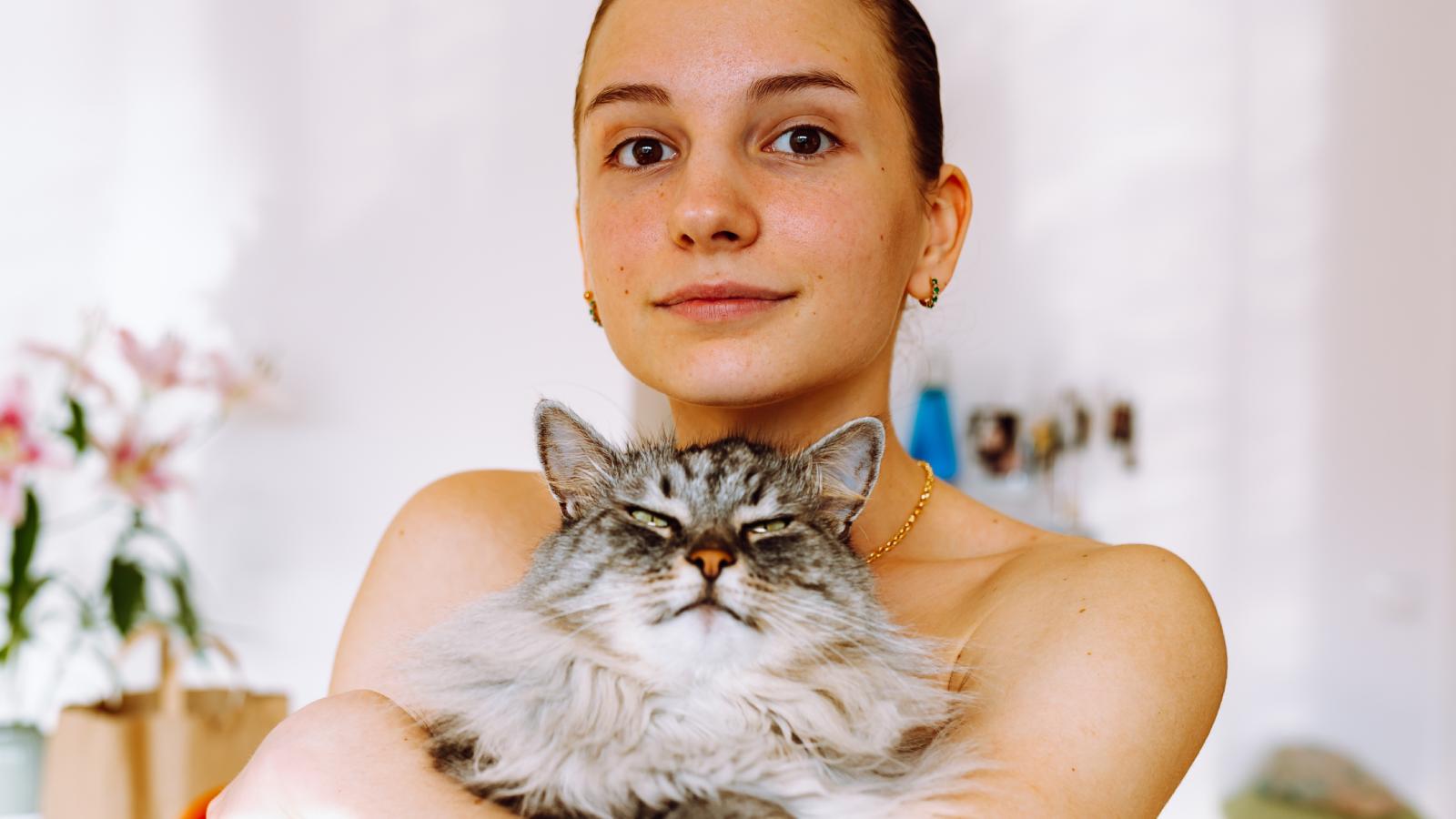 woman holding a cat