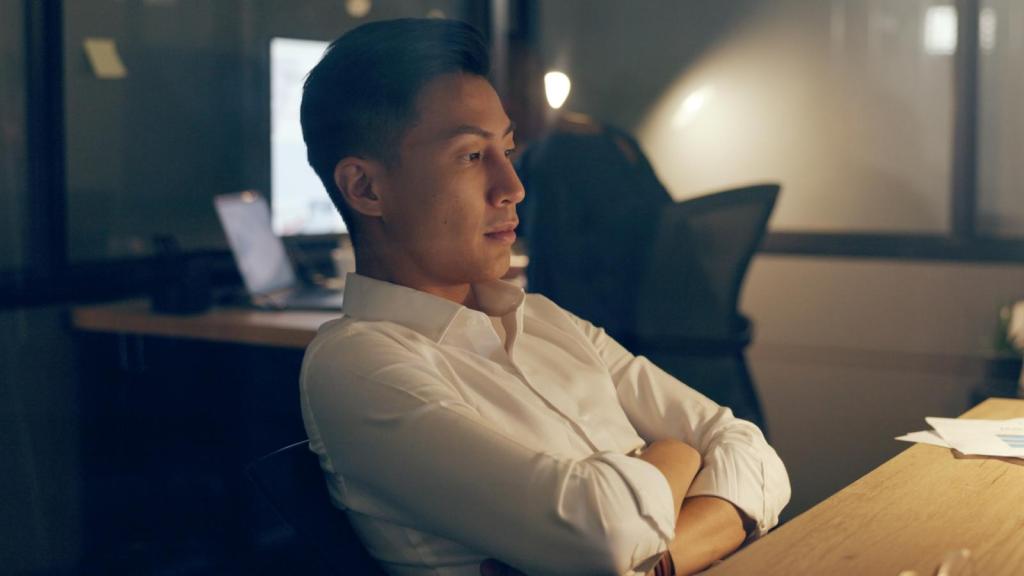 man at a desk at night
