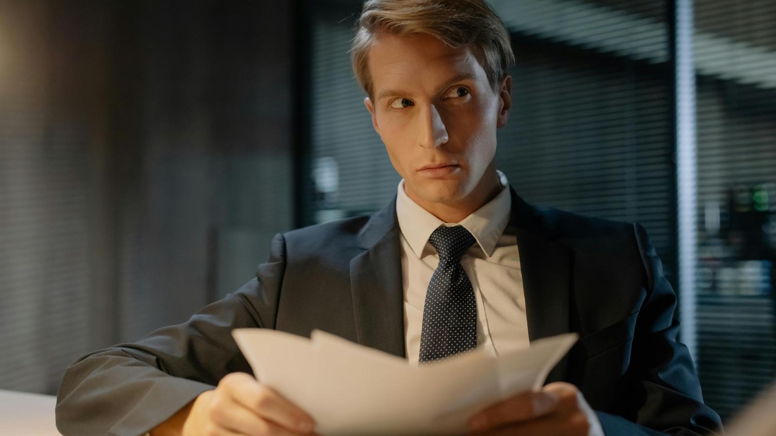 The Preemptive Timesheet: How One Corporate Worker Called Their Manager’s Bluff on Unpaid Overtime man at a desk