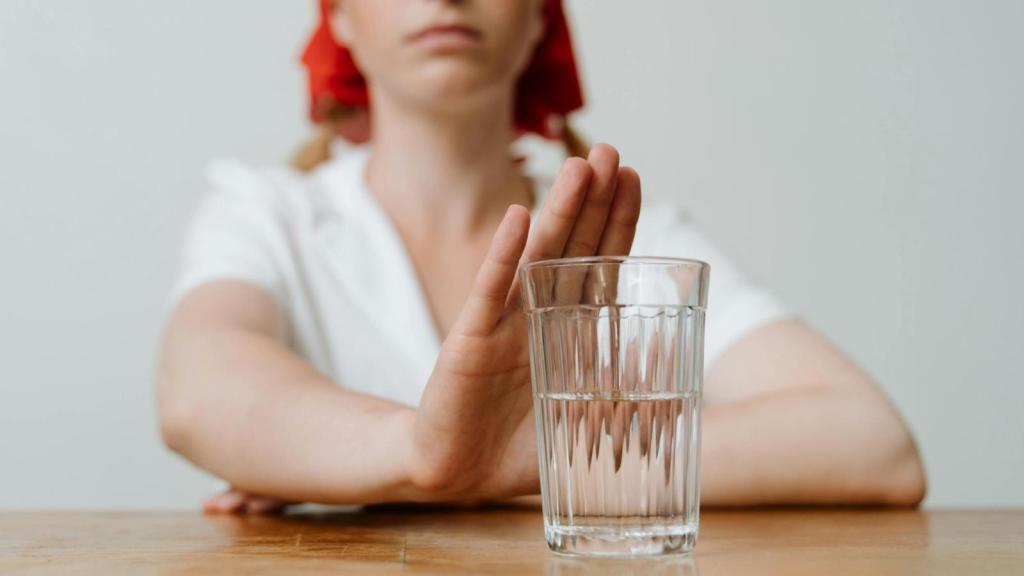 woman refusing a drink