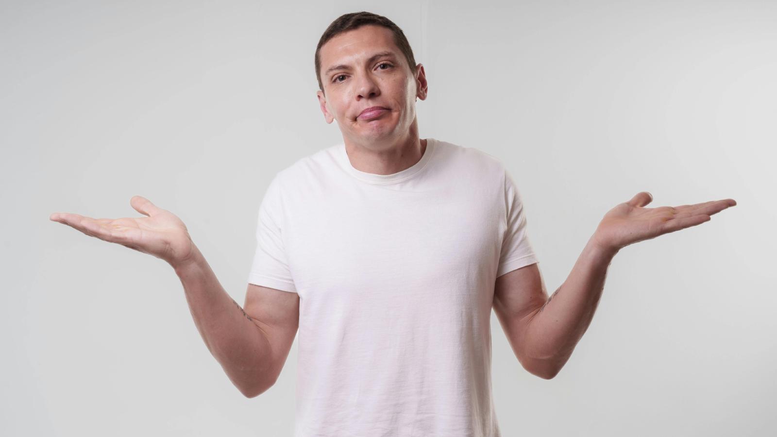 man shrugging his shoulders