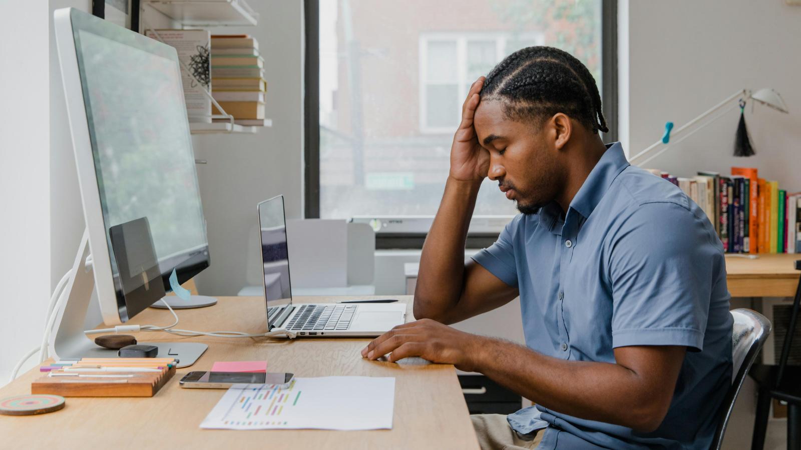 A Toxic Boss Told an Employee He Couldnt Get a Top Performance Review Unless He Worked for Free man at a desk