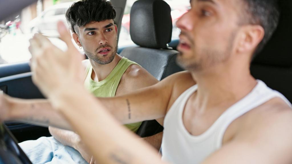 two men in a car