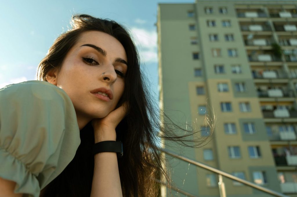 Young woman wondering why she has to be nice to customers