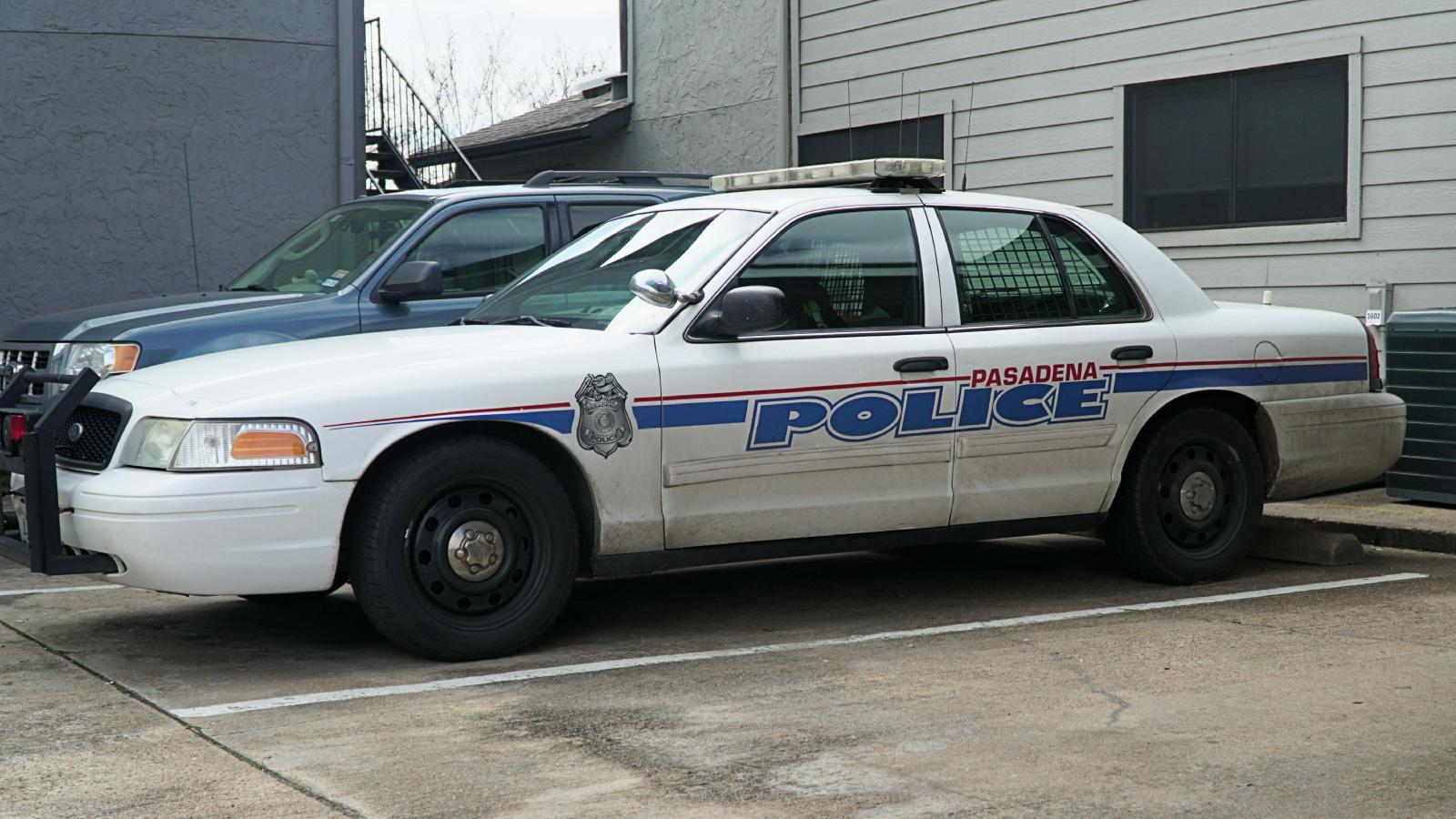 police car by apartment building