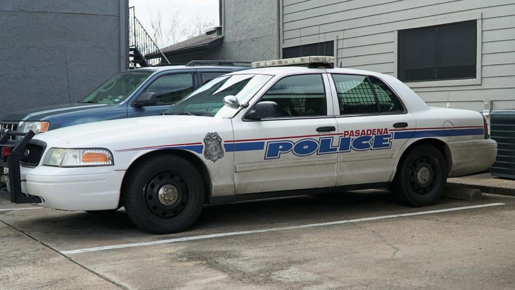 police car by apartment building