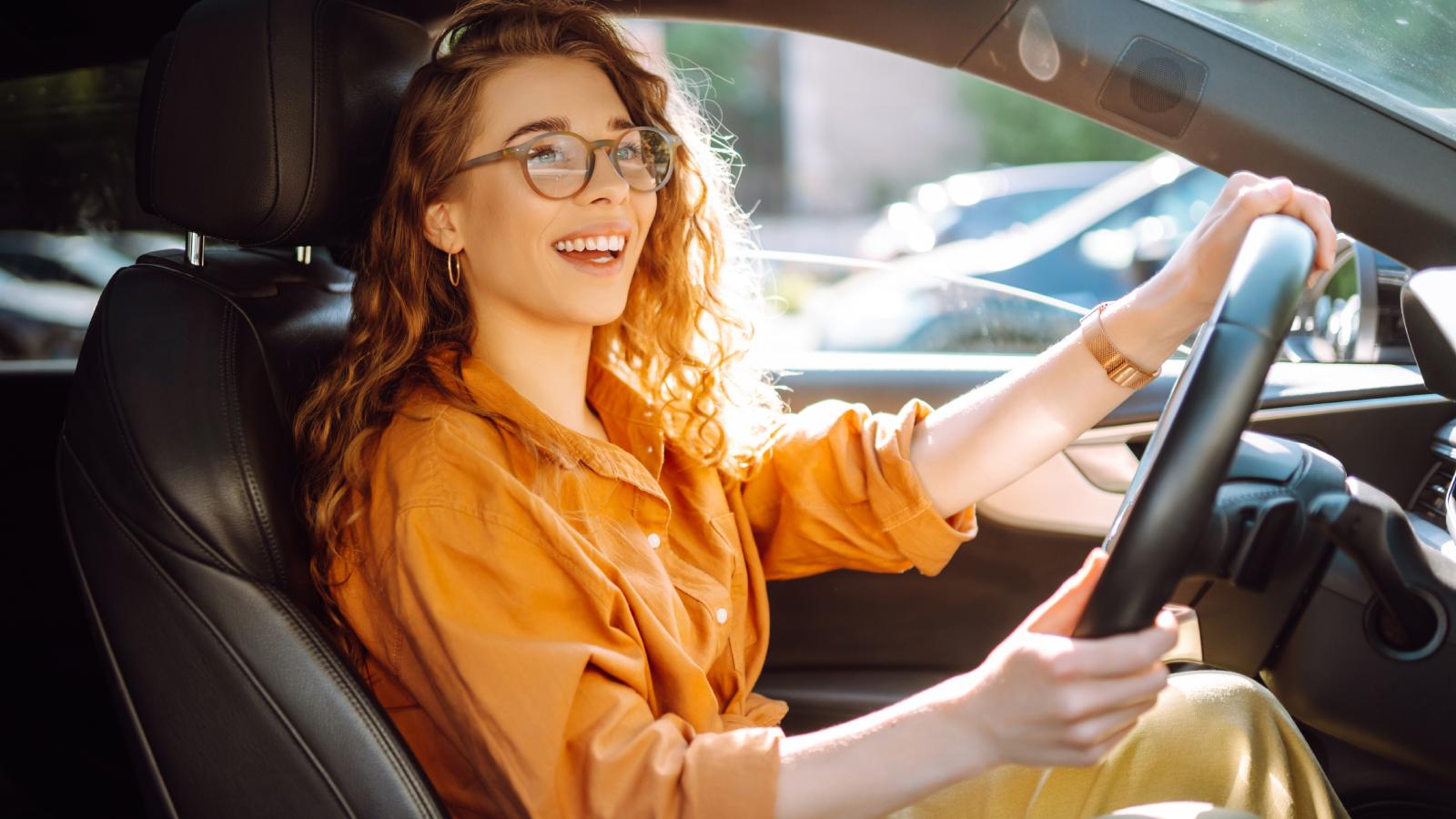 Woman Relentlessly Harassed by Entitled Neighbors Over Where She Parks on the Public Street Right Outside Her Own Home woman in a car