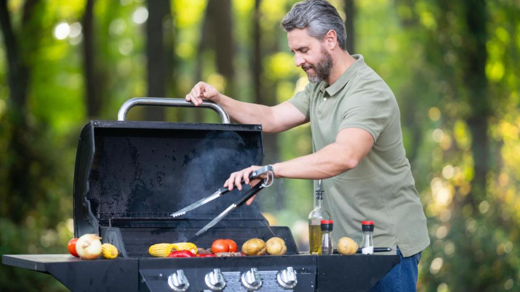 man grilling some food