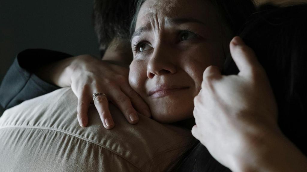 sad woman hugging a man